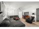 Living room with sectional sofa, fireplace and large TV at 16637 Livingston Ave, Lutz, FL 33559