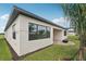 Backyard featuring a covered patio, fire pit, and lush tropical landscaping at 8320 Golden Beach Ct, Parrish, FL 34219