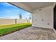 Private backyard with grassy area and brick pavers at 8320 Golden Beach Ct, Parrish, FL 34219
