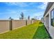 Private backyard with grassy area and block wall at 8320 Golden Beach Ct, Parrish, FL 34219