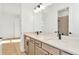 Modern bathroom with double vanity, quartz countertop and black fixtures at 8320 Golden Beach Ct, Parrish, FL 34219
