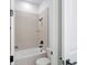 Bright bathroom featuring a shower-over-tub with ceramic tile surround, modern fixtures, and a neutral color palette at 8320 Golden Beach Ct, Parrish, FL 34219