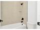 Clean bathroom with a bathtub, shower, and beige tile at 8320 Golden Beach Ct, Parrish, FL 34219