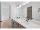 Modern bathroom features a double vanity, quartz countertops, and a large mirror at 8320 Golden Beach Ct, Parrish, FL 34219