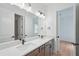 Modern bathroom features a double vanity, quartz countertops, and a large mirror at 8320 Golden Beach Ct, Parrish, FL 34219