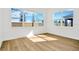 Bright bedroom with large windows and light wood flooring at 8320 Golden Beach Ct, Parrish, FL 34219