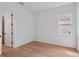 Bright bedroom with white walls, wood grain flooring and a street view window at 8320 Golden Beach Ct, Parrish, FL 34219