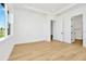 Spacious bedroom with wood floors and access to a walk-in closet at 8320 Golden Beach Ct, Parrish, FL 34219