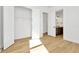 Bedroom with wood floors, closet, and adjacent bathroom at 8320 Golden Beach Ct, Parrish, FL 34219