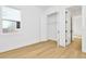 Bright bedroom with light wood flooring and a window at 8320 Golden Beach Ct, Parrish, FL 34219