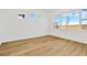 Bright bedroom with large windows and light wood flooring at 8320 Golden Beach Ct, Parrish, FL 34219