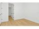 Bright bedroom with light wood floors and access to hallway at 8320 Golden Beach Ct, Parrish, FL 34219