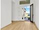 Bright and airy foyer with light wood flooring and an open view to the outside at 8320 Golden Beach Ct, Parrish, FL 34219