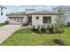 Beautiful home with a manicured lawn, modern design, and brick driveway at 8320 Golden Beach Ct, Parrish, FL 34219