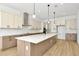 Modern kitchen with island and stainless steel appliances at 8320 Golden Beach Ct, Parrish, FL 34219