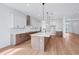Modern kitchen with an island, stainless steel appliances, and plenty of cabinet space at 8320 Golden Beach Ct, Parrish, FL 34219