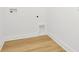 Small laundry room with light wood flooring at 8320 Golden Beach Ct, Parrish, FL 34219