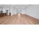 Open-concept living room with hardwood floors, white walls, and abundant natural light at 8320 Golden Beach Ct, Parrish, FL 34219