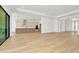 Open living room with kitchen and access to patio at 8320 Golden Beach Ct, Parrish, FL 34219