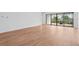 Bright living room with light wood flooring and sliding glass doors leading to the outdoor patio at 8320 Golden Beach Ct, Parrish, FL 34219