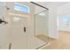 Walk-in shower with glass enclosure and modern tile at 8320 Golden Beach Ct, Parrish, FL 34219