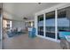 Covered ocean view balcony featuring a dining space, outdoor kitchen and comfortable seating at 16300 Gulf Blvd # 300B, Redington Beach, FL 33708