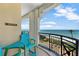 Ocean views from a private balcony featuring seating, railing and stucco arch at 16300 Gulf Blvd # 300B, Redington Beach, FL 33708