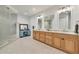 Bathroom featuring walk-in shower, double vanity, tile flooring, and plenty of bright light at 16300 Gulf Blvd # 300B, Redington Beach, FL 33708