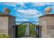 Gated beach access with lush greenery and a serene view of the ocean at 16300 Gulf Blvd # 300B, Redington Beach, FL 33708