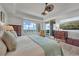 Bright bedroom with a water view, dresser, and a comfortable-looking bed at 16300 Gulf Blvd # 300B, Redington Beach, FL 33708