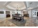 Formal dining room featuring chandelier lighting and ample seating for Gathering and guests at 16300 Gulf Blvd # 300B, Redington Beach, FL 33708