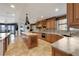 Bright kitchen featuring an island with designer details, marble countertops, and stainless steel appliances at 16300 Gulf Blvd # 300B, Redington Beach, FL 33708