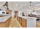 Spacious kitchen features an island, ample counter space, wine storage, and stainless appliances at 16300 Gulf Blvd # 300B, Redington Beach, FL 33708