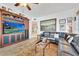 Bright living room boasts a leather sectional, area rug, and entertainment center, perfect for relaxation at 16300 Gulf Blvd # 300B, Redington Beach, FL 33708