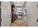 Grand entrance into the open-concept living area with tiled floors and a gorgeous chandelier at 16300 Gulf Blvd # 300B, Redington Beach, FL 33708