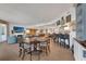 Spacious living area with fireplace, a large dining table, and an open floor plan great for entertaining at 16300 Gulf Blvd # 300B, Redington Beach, FL 33708