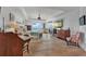 Bright primary bedroom featuring water views, a ceiling fan and hardwood flooring at 16300 Gulf Blvd # 300B, Redington Beach, FL 33708