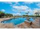 Inviting condo complex pool with elegant steps and a stone patio at 16300 Gulf Blvd # 300B, Redington Beach, FL 33708