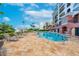 Relaxing condo complex pool with elegant lounge chairs and lush landscaping at 16300 Gulf Blvd # 300B, Redington Beach, FL 33708