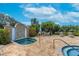 Inviting condo complex hot tub surrounded by lush greenery and a stone patio at 16300 Gulf Blvd # 300B, Redington Beach, FL 33708