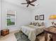 Comfortable bedroom with wood flooring and ceiling fan at 4719 Cassio Ct, Bradenton, FL 34211