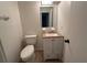 Clean bathroom with granite vanity and updated fixtures at 39616 Meadowood Loop, Zephyrhills, FL 33542