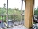 Screened in balcony offers a private outdoor space with views of the neighborhood at 5125 Palm Springs Blvd # 1303, Tampa, FL 33647