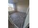 Bedroom featuring a window with blinds and wood-look flooring at 5125 Palm Springs Blvd # 1303, Tampa, FL 33647