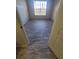 Bedroom featuring a window with blinds and wood-look flooring at 5125 Palm Springs Blvd # 1303, Tampa, FL 33647