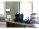 Community coffee station with coffee makers and supplies at 5125 Palm Springs Blvd # 1303, Tampa, FL 33647