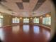 Spacious empty hall with large windows providing ample natural light, suitable for various activities and events at 5125 Palm Springs Blvd # 1303, Tampa, FL 33647