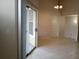 Living room with sliding door to balcony at 5125 Palm Springs Blvd # 1303, Tampa, FL 33647