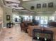 Inviting community lounge area with comfortable seating and a fitness center view at 5125 Palm Springs Blvd # 1303, Tampa, FL 33647
