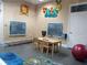 Fun playroom with colorful decorations, tables, chairs, blackboards and toys, designed for engaging activities at 5125 Palm Springs Blvd # 1303, Tampa, FL 33647